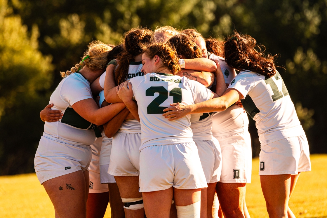 Women's rugby group hug
