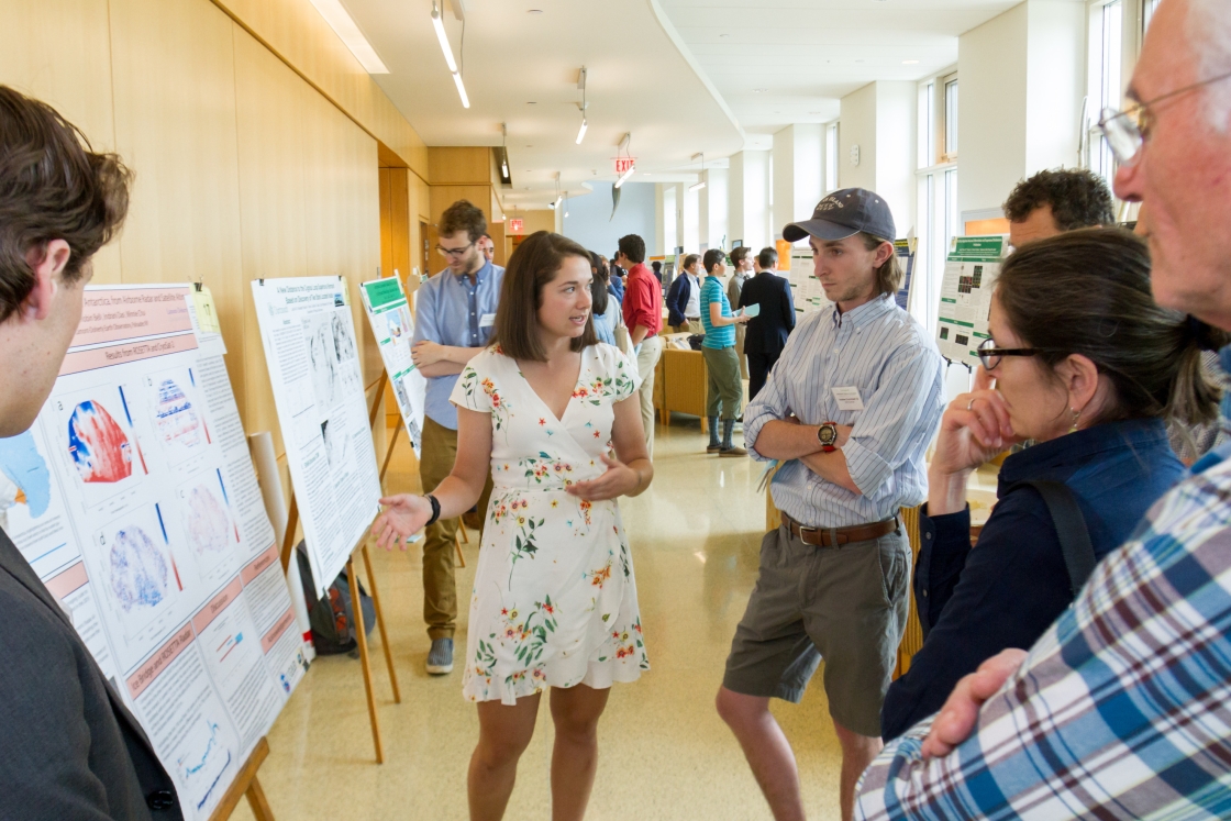 Students use posters to demonstrate their undergraduate research