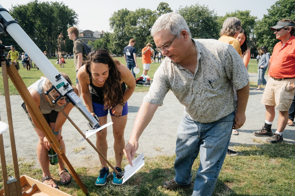 People safely watch a solar eclipse in August 2017 on the Green