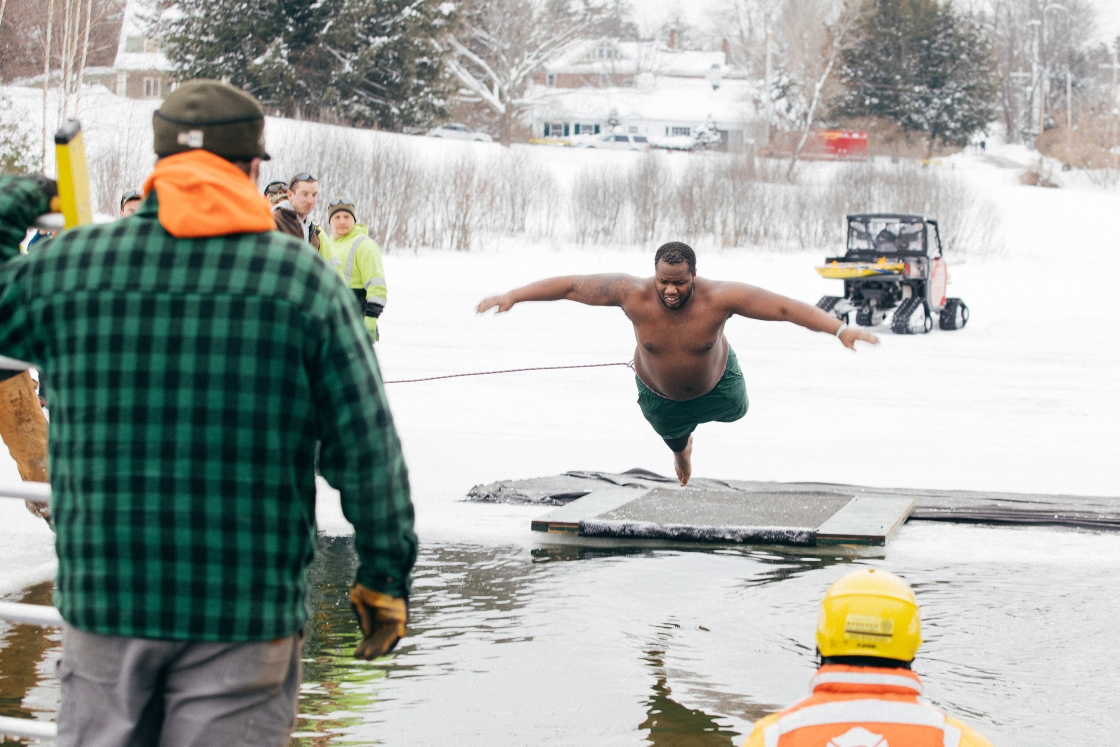 Man throwing himself into Occom Pond