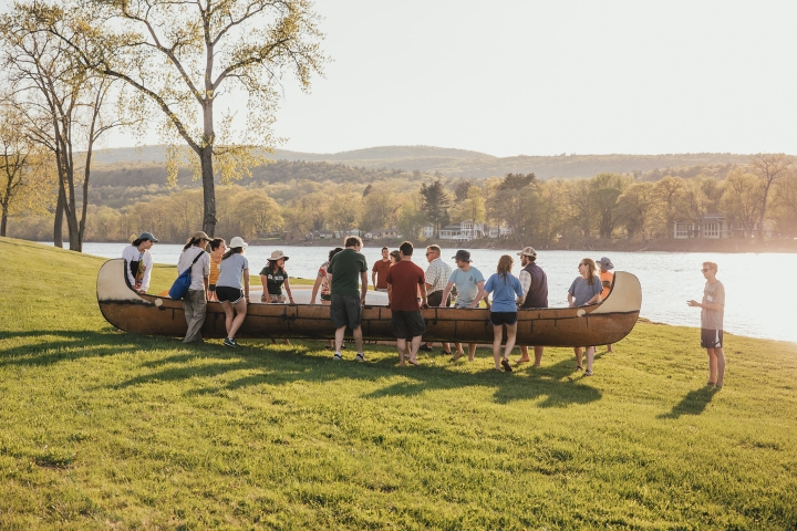 Seniors carrying a canoe to the Connecticut River.