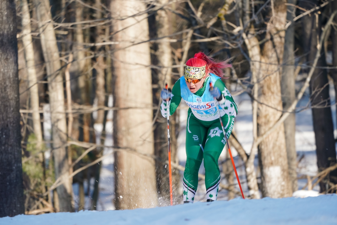 Student with flaming red hair races cross-country