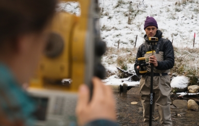 Preparing surveying equipment for research into how the topography of a stream channel changes after dam removal