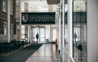 Student exits the Thayer lobby