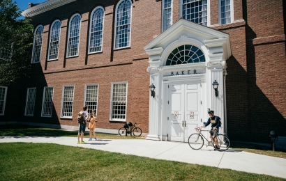 Students chatting outside of Baker entrance