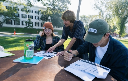 Students and a professor holding class outside