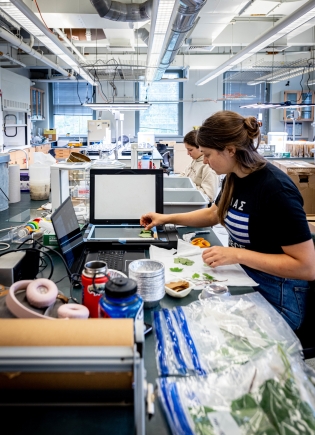 Leah Prudence and Raquel Menella working in a lab