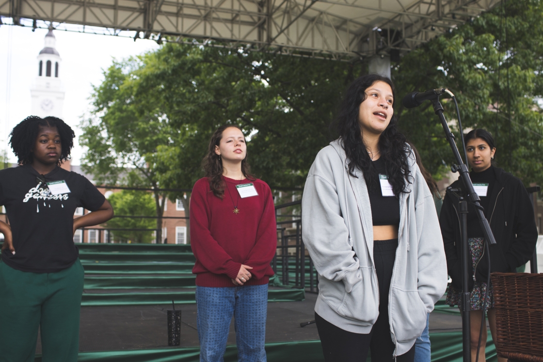 Students rehearsing reading names of graduates for Commencement.