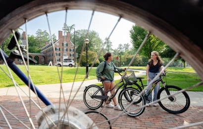 Students talking outside the bike shop.