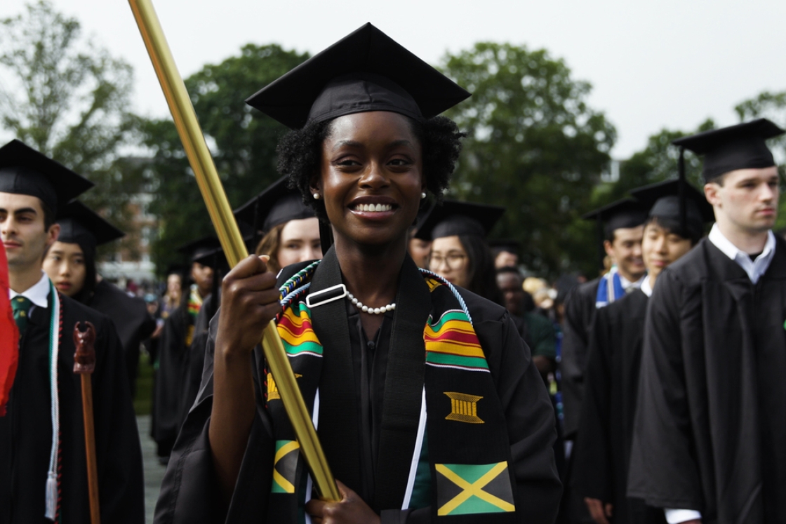 Graduate marching in the procession at Commencement