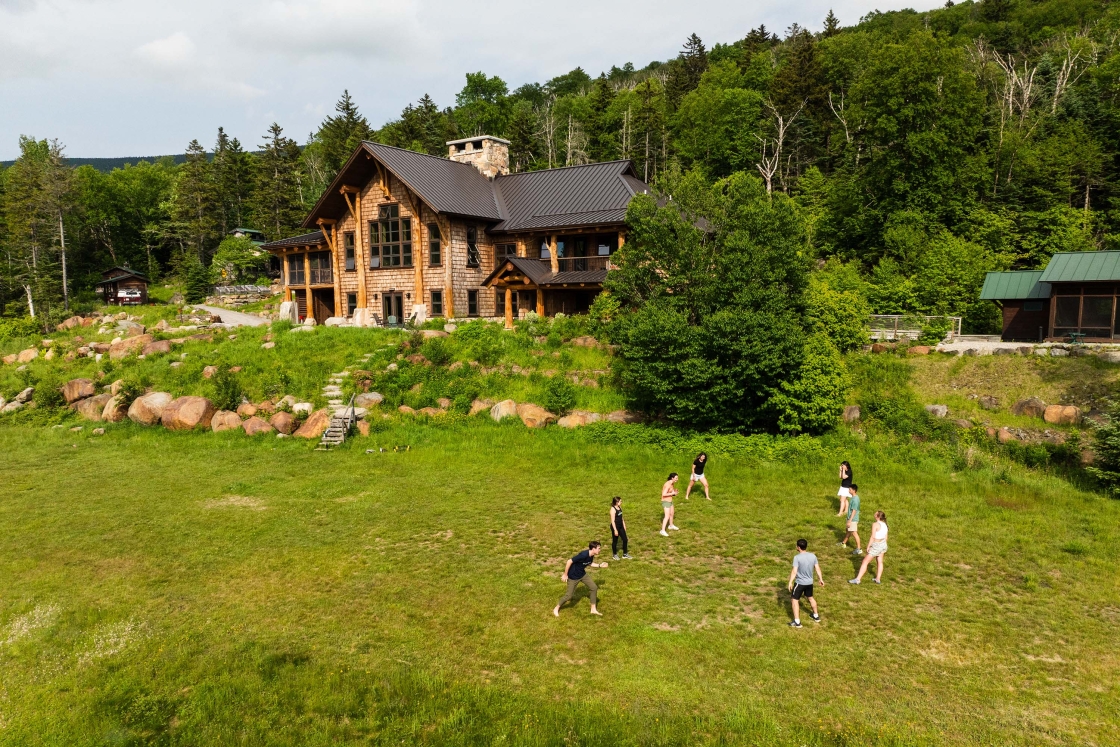 Students play outside Moosilauke Ravine Lodge