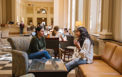 Students talking in the lobby of the Library