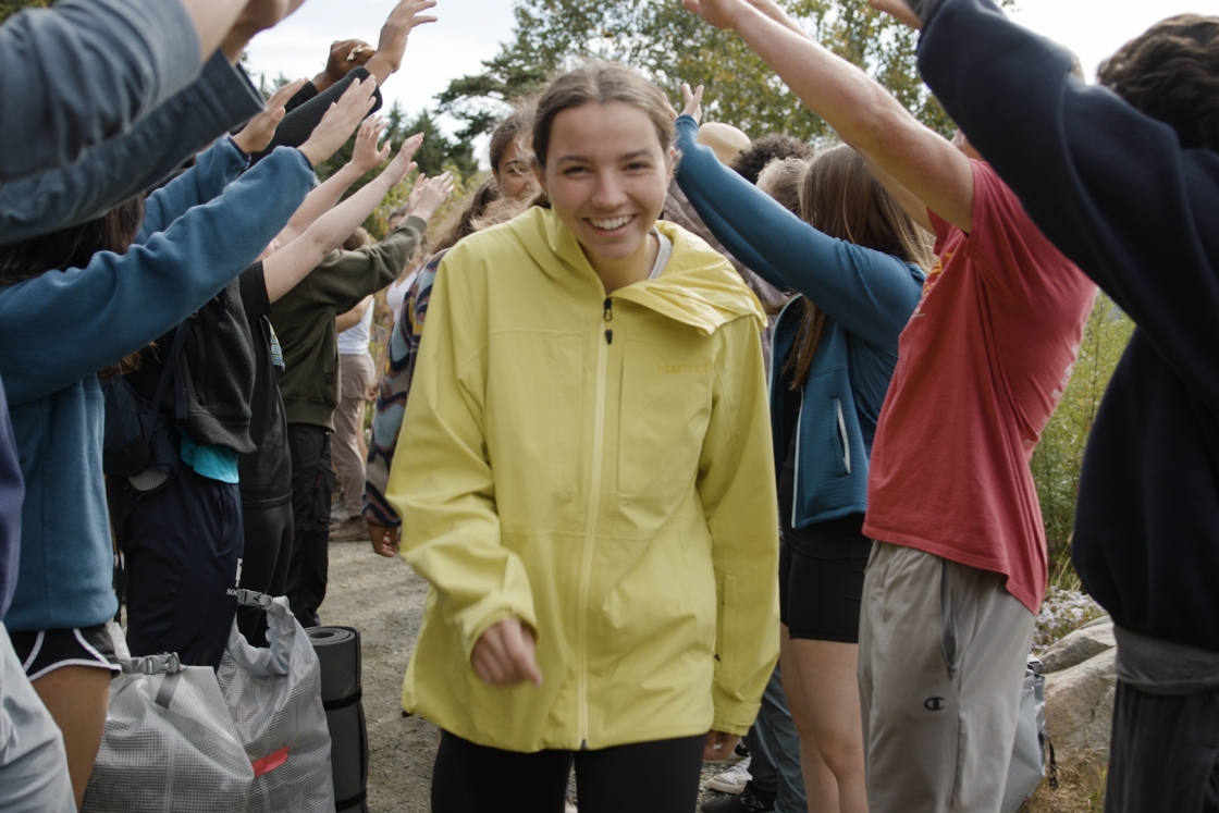 Student walking towards camera
