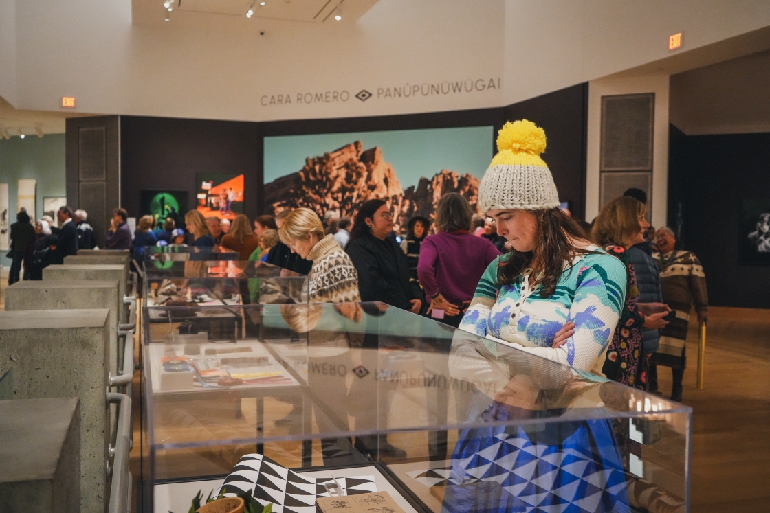 Visitors perusing the props and other items used to create Romero's photos