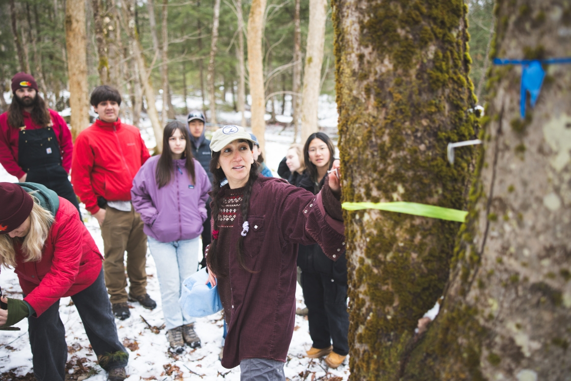 Emily Sigman and the sugar crew in winter clothes at the sugarbush