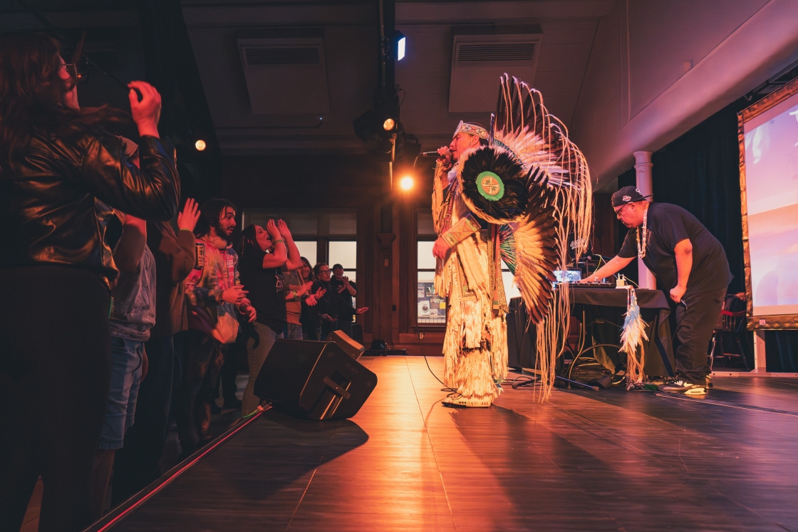 Supaman performing on stage