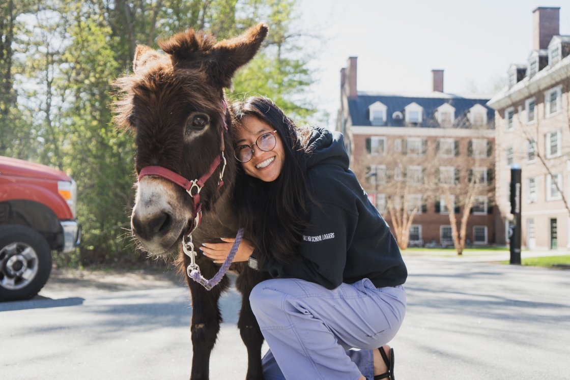 Emily Masuda cuddling a donkey