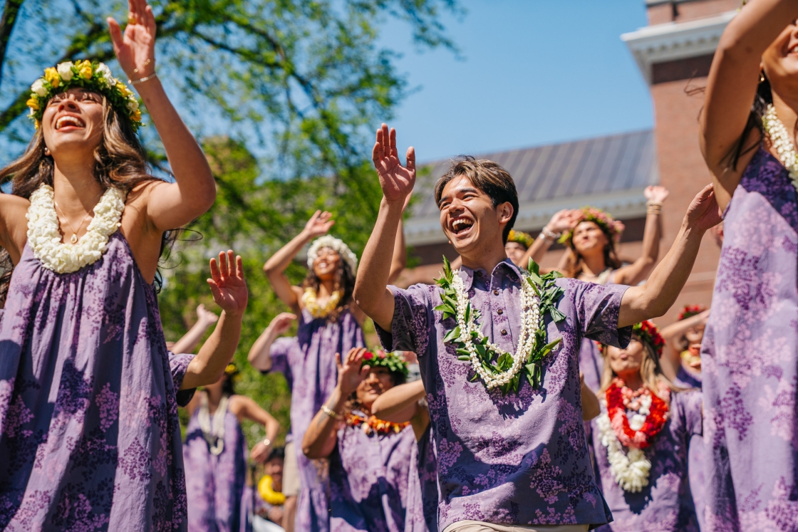 Chase Kamikawa laughs as he dances with friends from Hokupa‘a