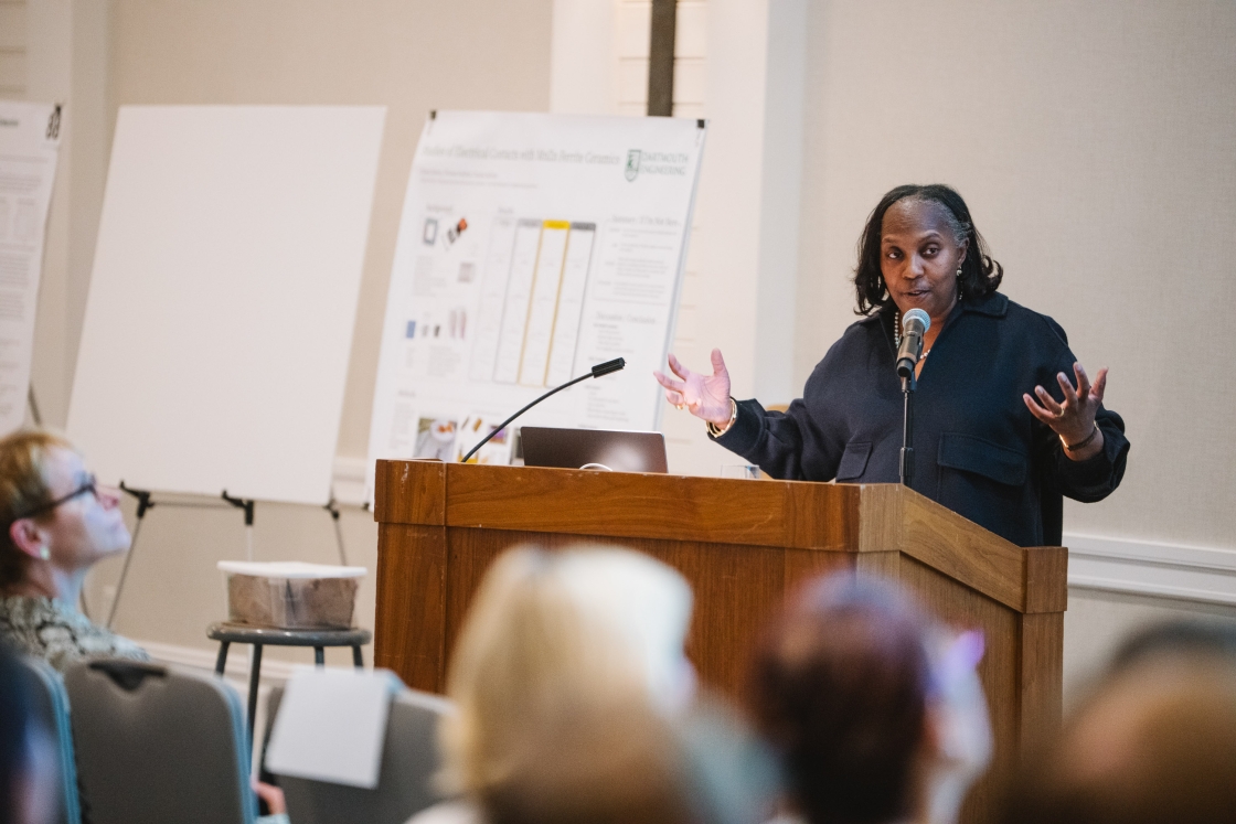 Dr. Odette Harris speaking at a podium