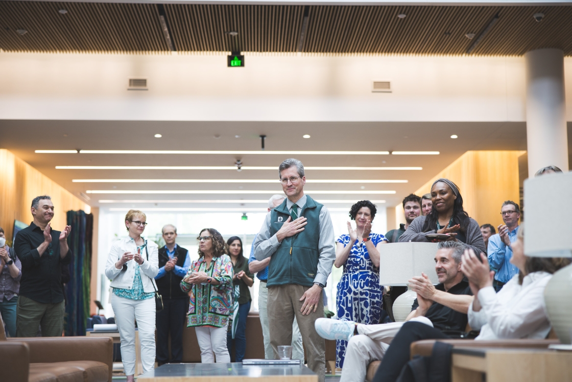 Community members clapping for Dave Kotz