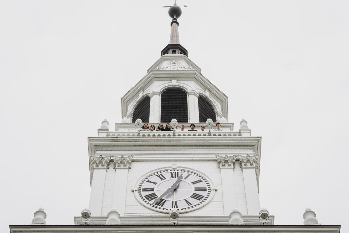 Students looking over the railing on the top of Baker Tower