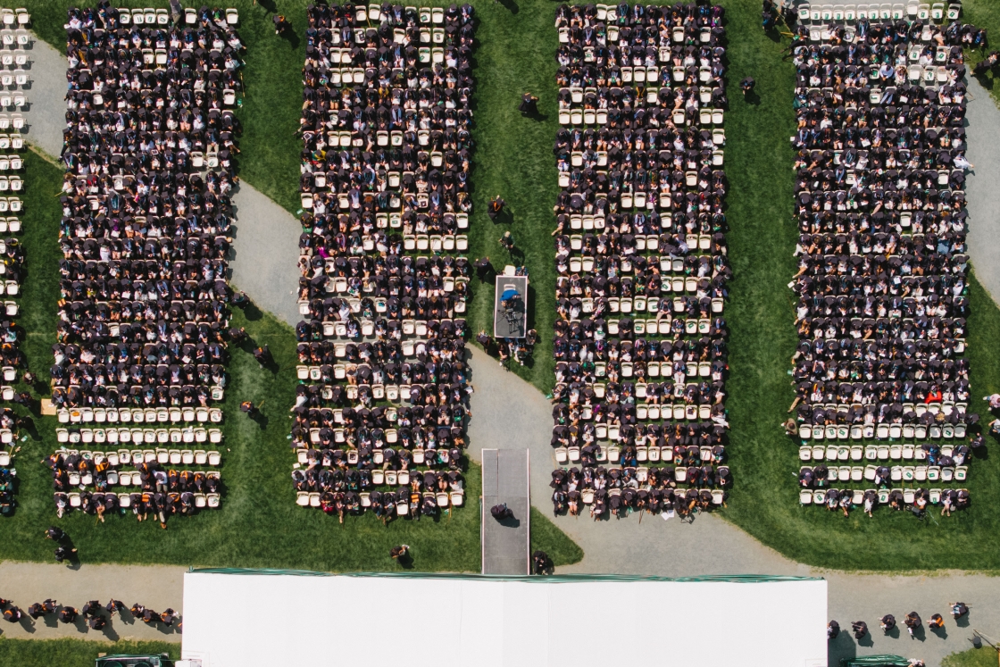 Birds-eye-view of graduates sitting at Commencement