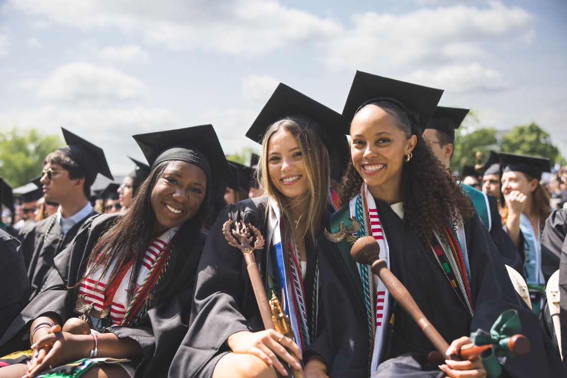 Three graduates pose for a picture