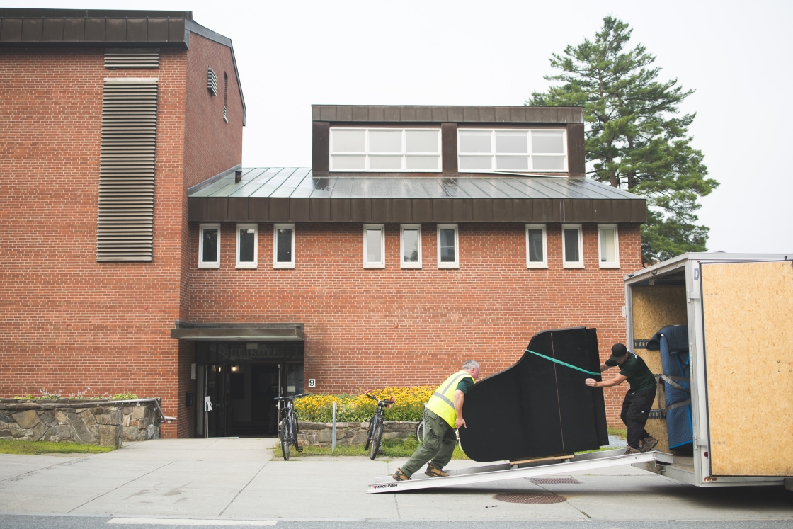Piano being pushed up a ramp