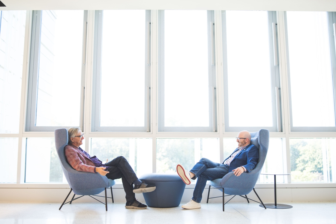 Bill Burnett and Joe Catrino in chairs