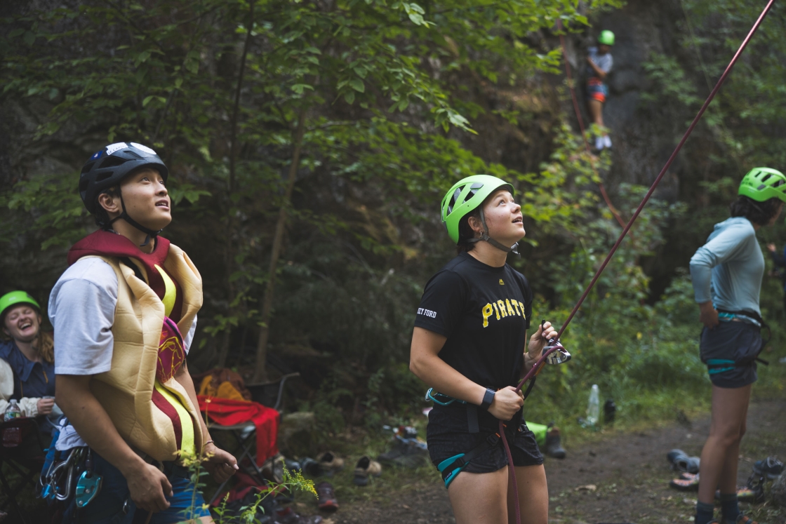 Students belaying rock climbers