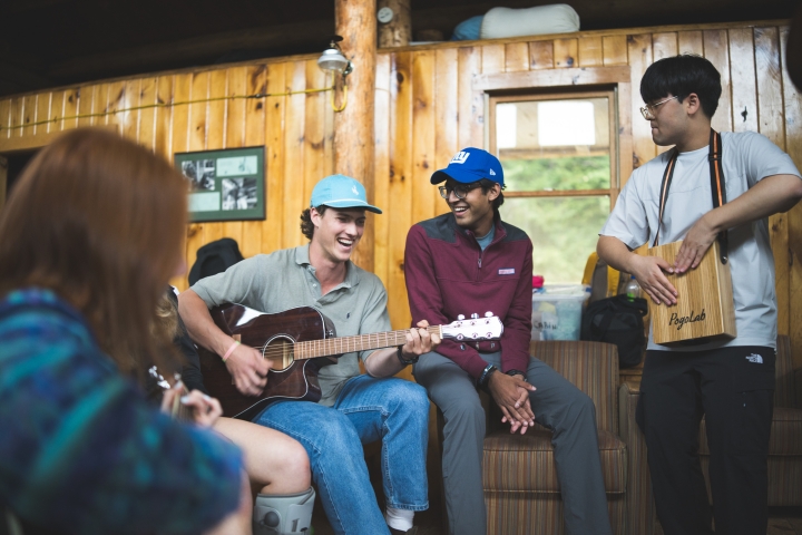 Students singing and playing guitar