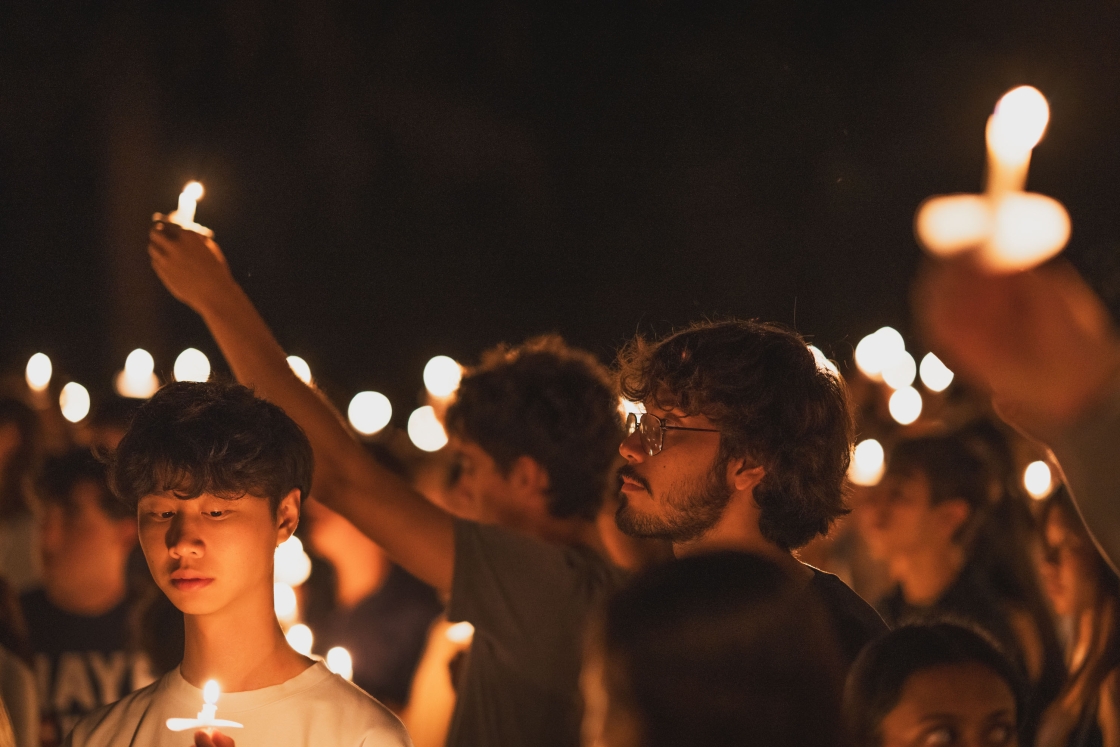 Students holding up candles