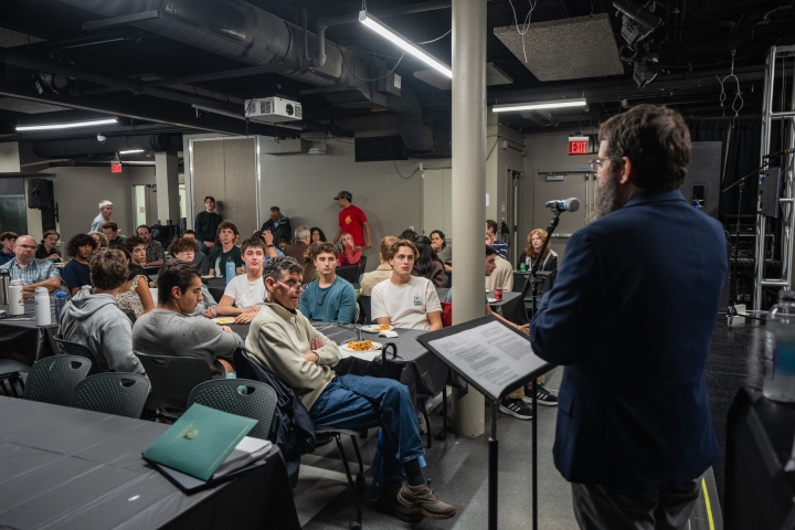 Sean Westwood speaking at a podium