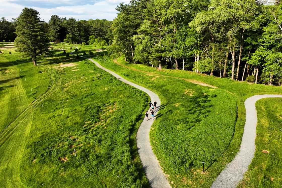 Triathlon team members running a trail