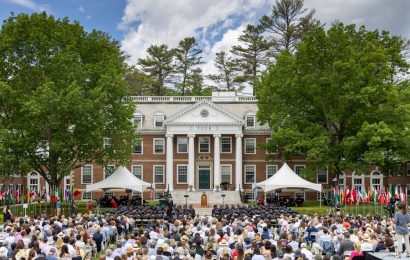 Tuck graduates listening to the commencement speech