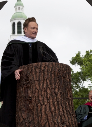Conan O'Brien speaking at the podium at Commencement.