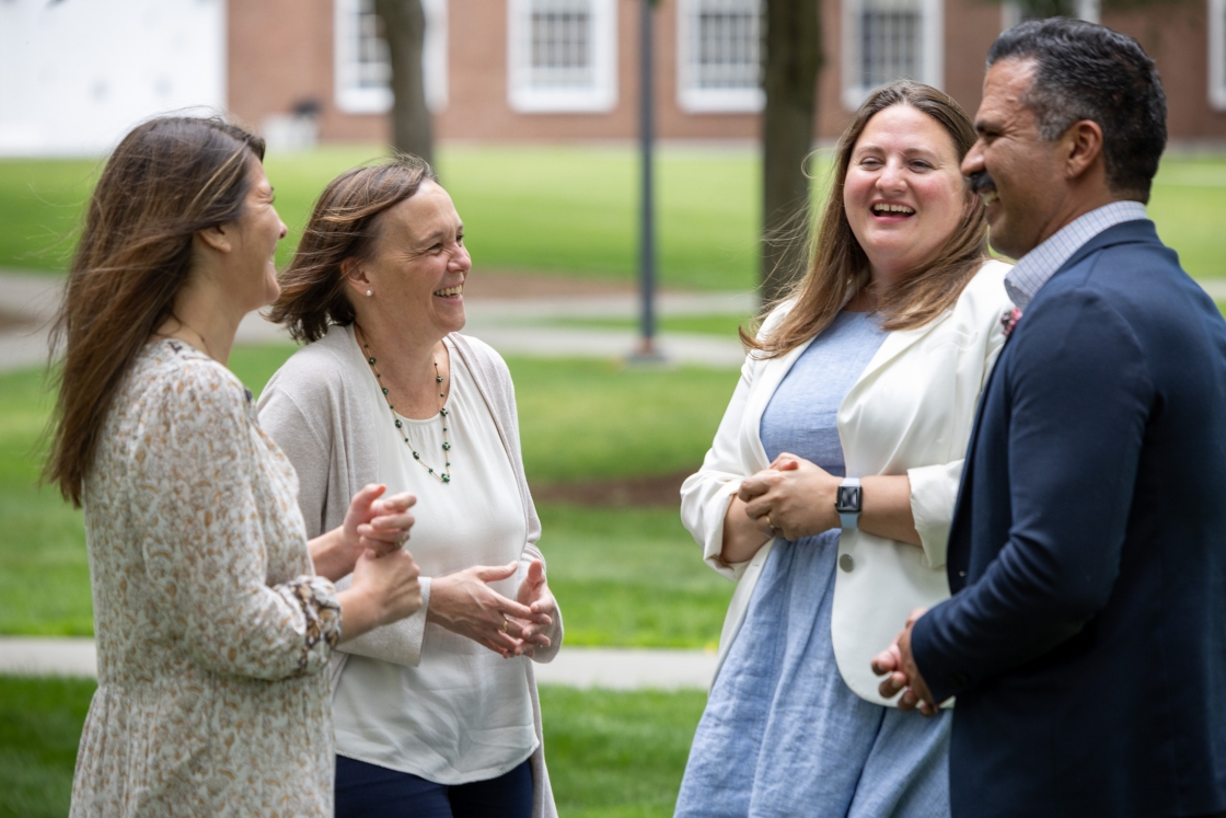 Faculty laughing together