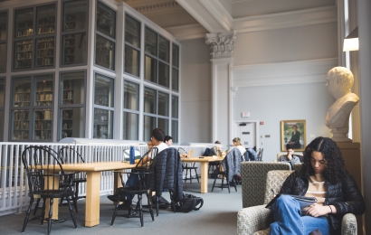 Grace Caldwell writing in a notebook in Rauner