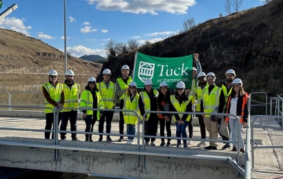 Tuck students with large Tuck flag