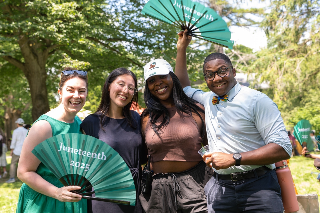 Attendees of the event get together for a group picture