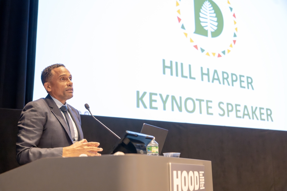 Hill Harper at a podium