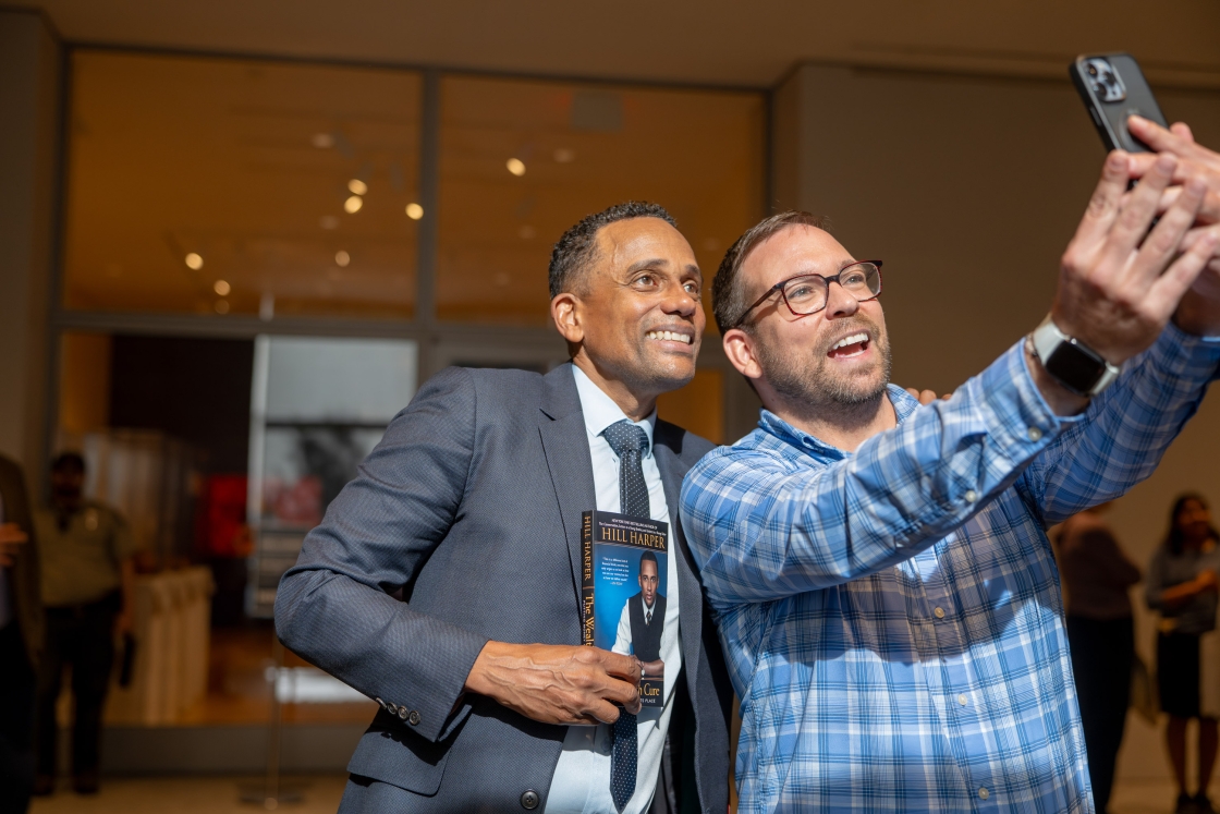 Nick Davis taking a selfie with Hill Harper