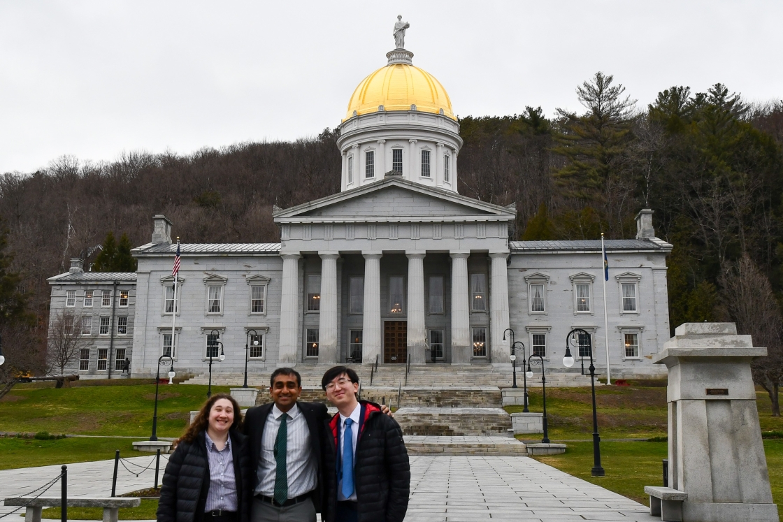 Erin Parker, Pranav Akella, and Alan Cui outside the Vermont Statehouse