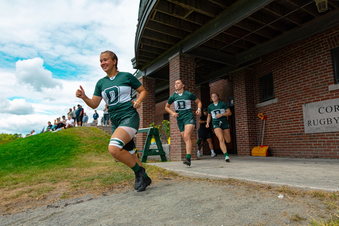 Women's Rugby members running