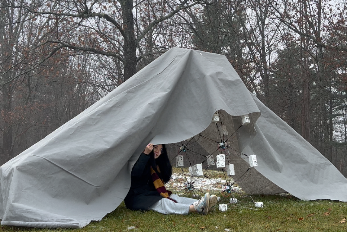 Student under a tarp